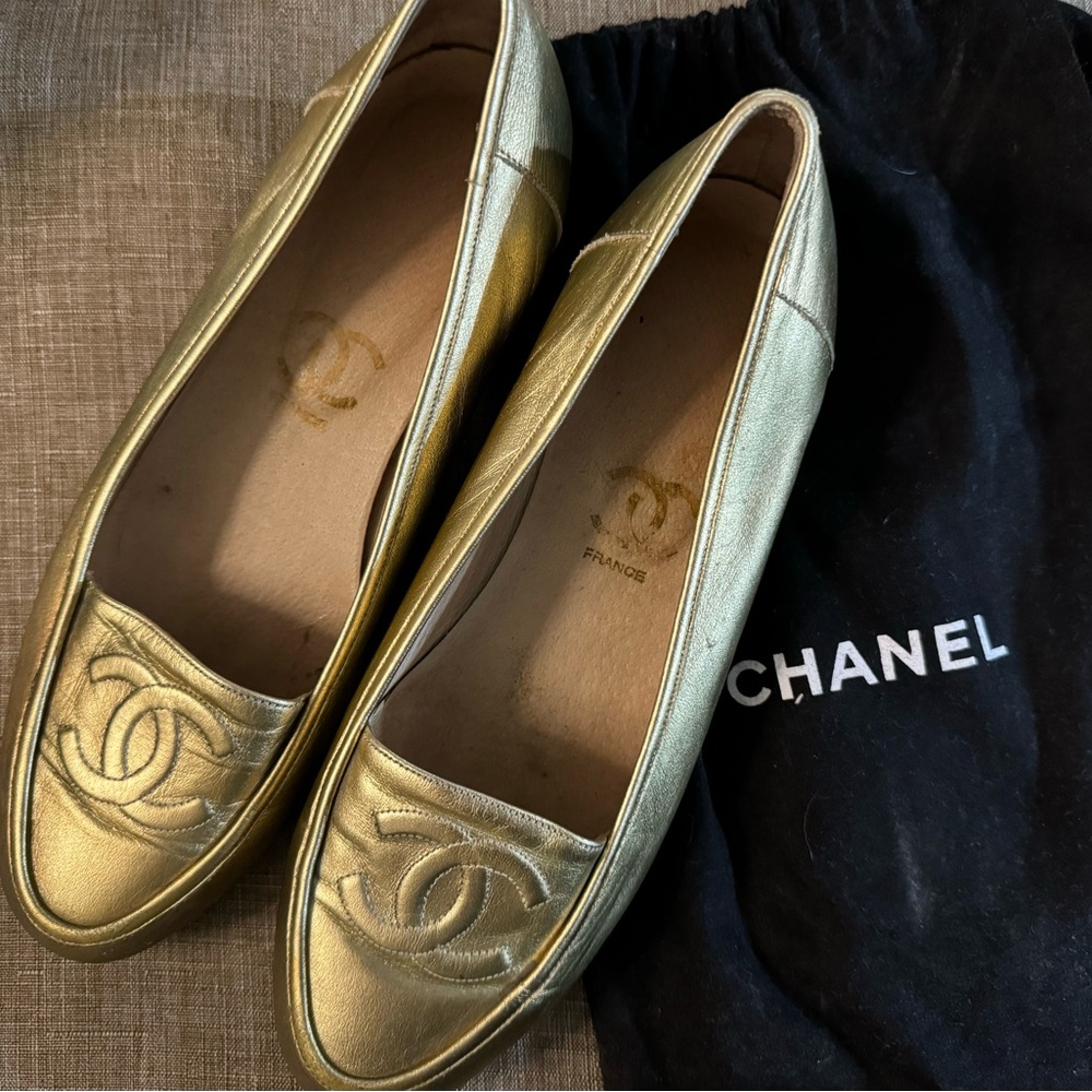 Gold Chanel flats with dust bag